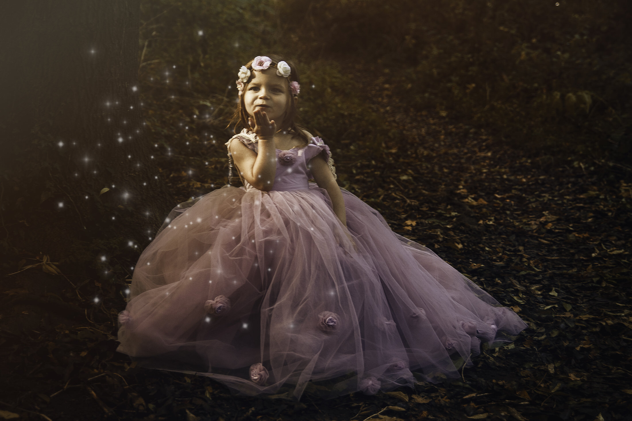 little girl in a fairy princess dress in woodland by Newborn Photographer in Medway, Kent
