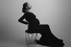 Maternity photoshoot taken in my studio in Medway Kent. Mum to be wearing black dress
